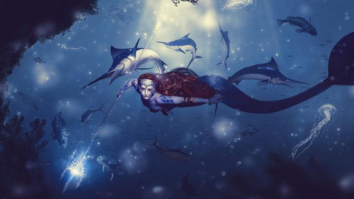A blue mermaid queen in the sunlight
