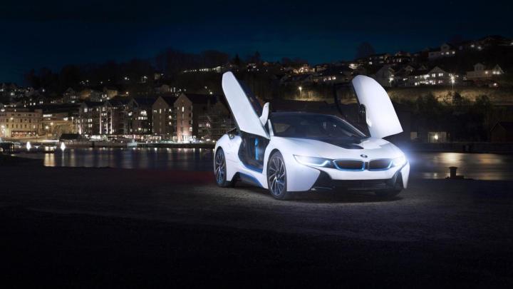 White BMW I8 Concept with opened doors in the city Wallpaper Download 