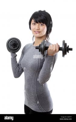 Upper body shot of a slim young female fitness model, wearing a long 