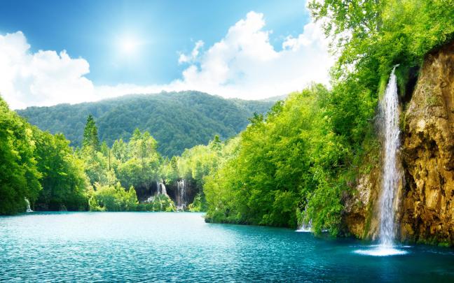 Summer sunny day and wonderful waterfall in the nature Wallpaper 