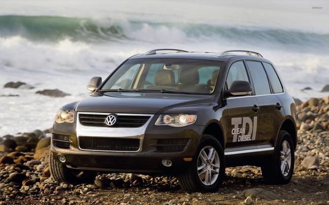 Black Volkswagen Touareg TDI Clean Diesel on a rocky beach wallpaper 