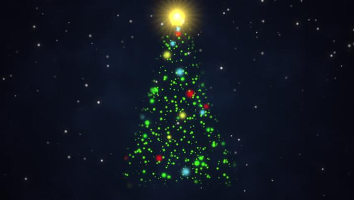 Animated Christmas Tree With A Bright Tree Topper Poised Against A Dark 